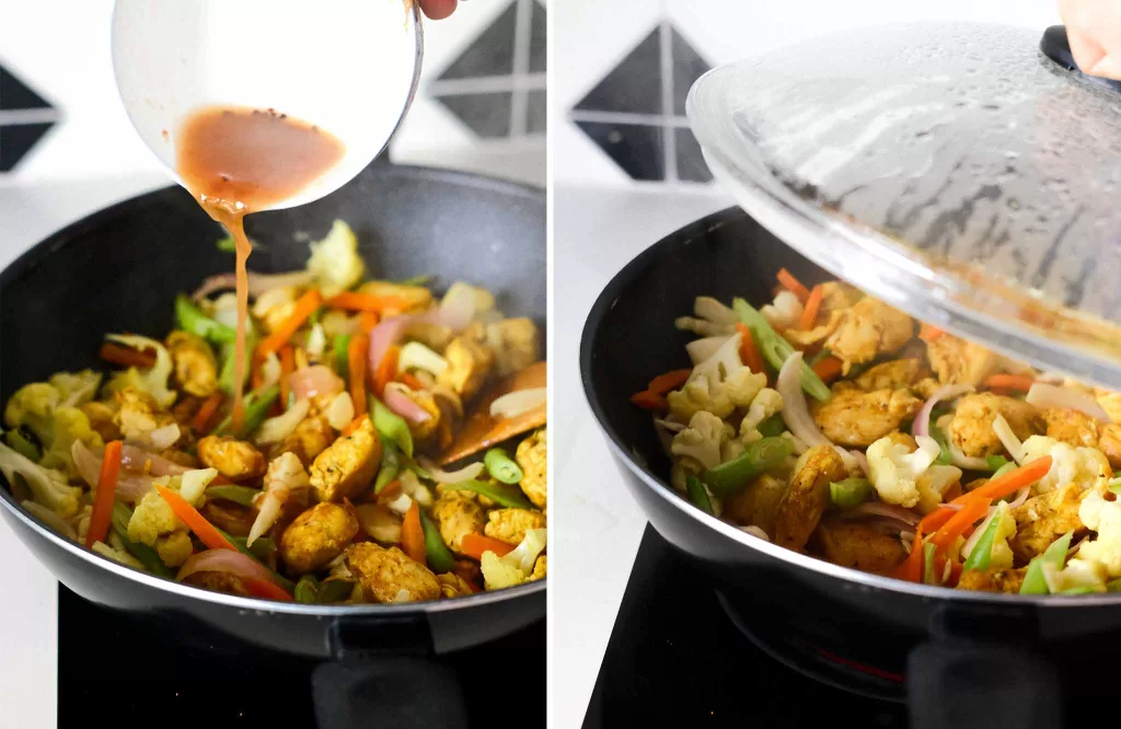 Adding tamarind paste into the wok and cover the wok with lid to let the turmeric chicken with vegetables steaming