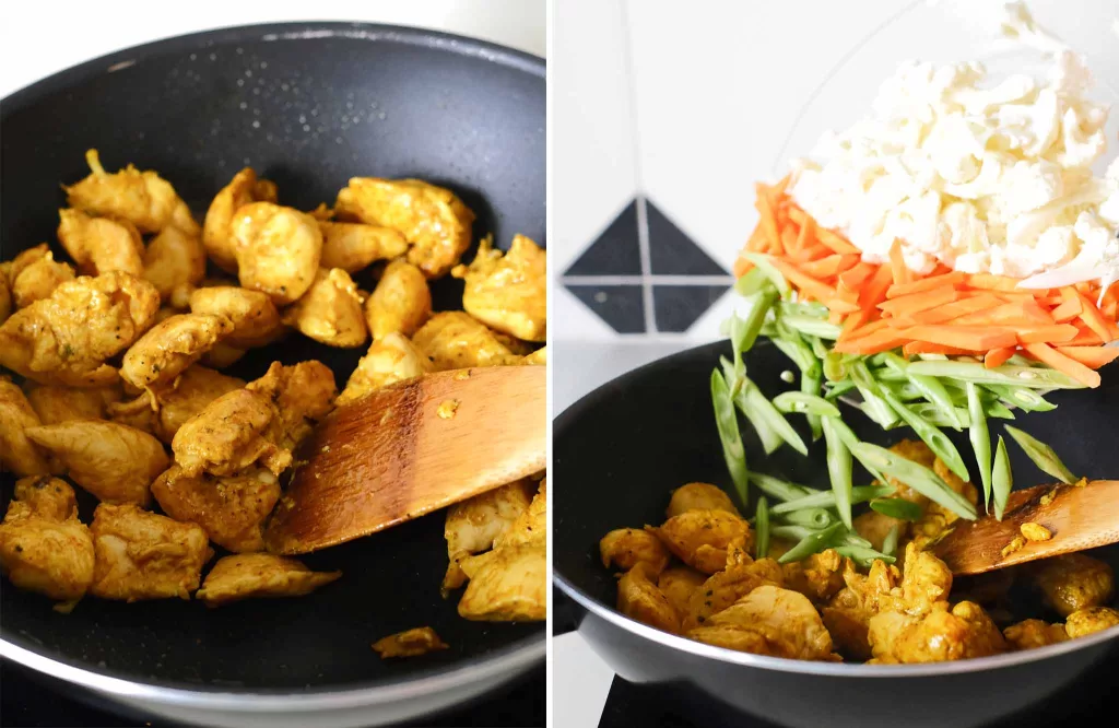 Stir fry turmeric black pepper chicken in a wok and adding vegetables into the wok