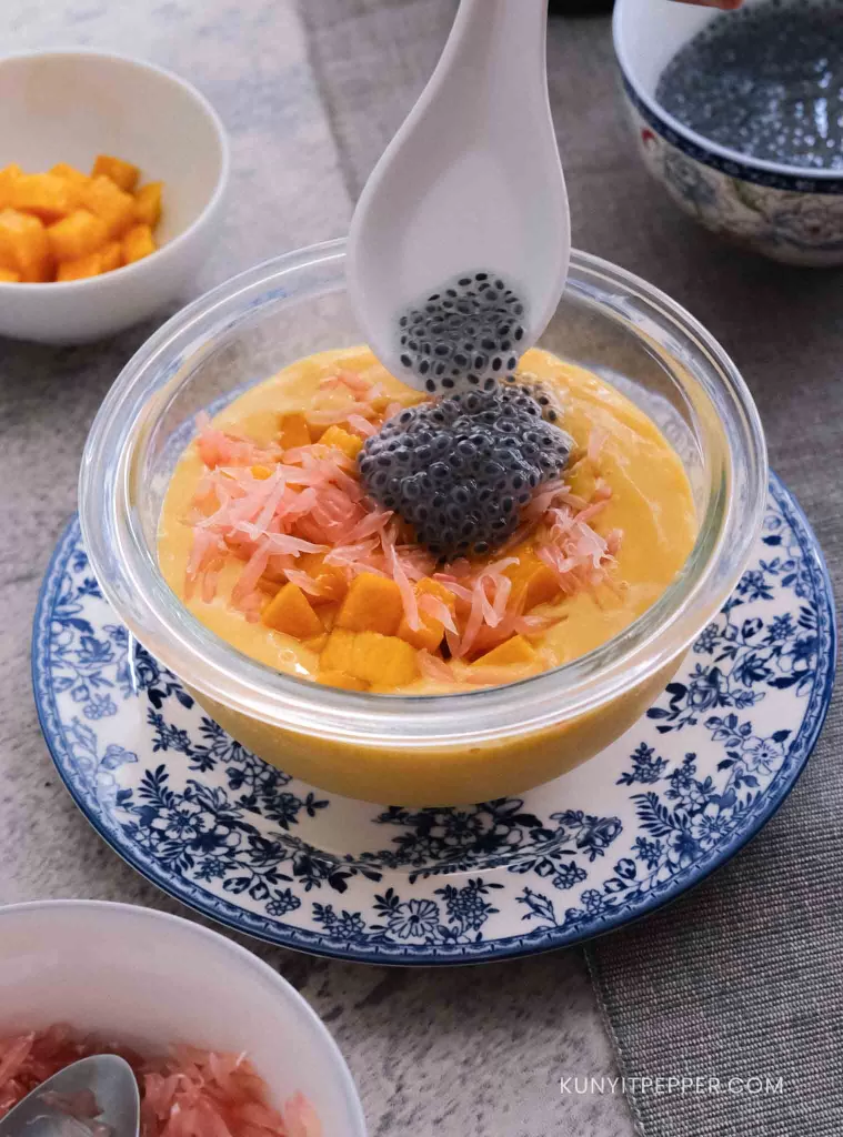 Adding Basil Seeds on Top of Mango Pomelo Sago