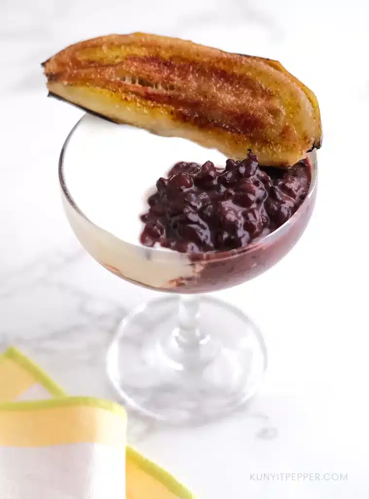 black rice pudding with yogurt and caramelized banana on top