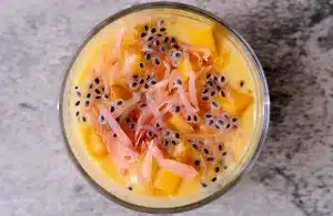 Top view of mango pomelo sago with basil seeds in a glass bowl
