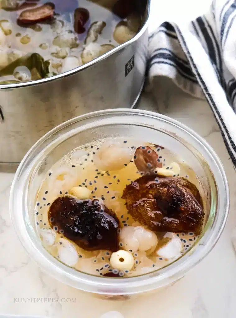 A bowl of Lai Chi Kang next to a pot