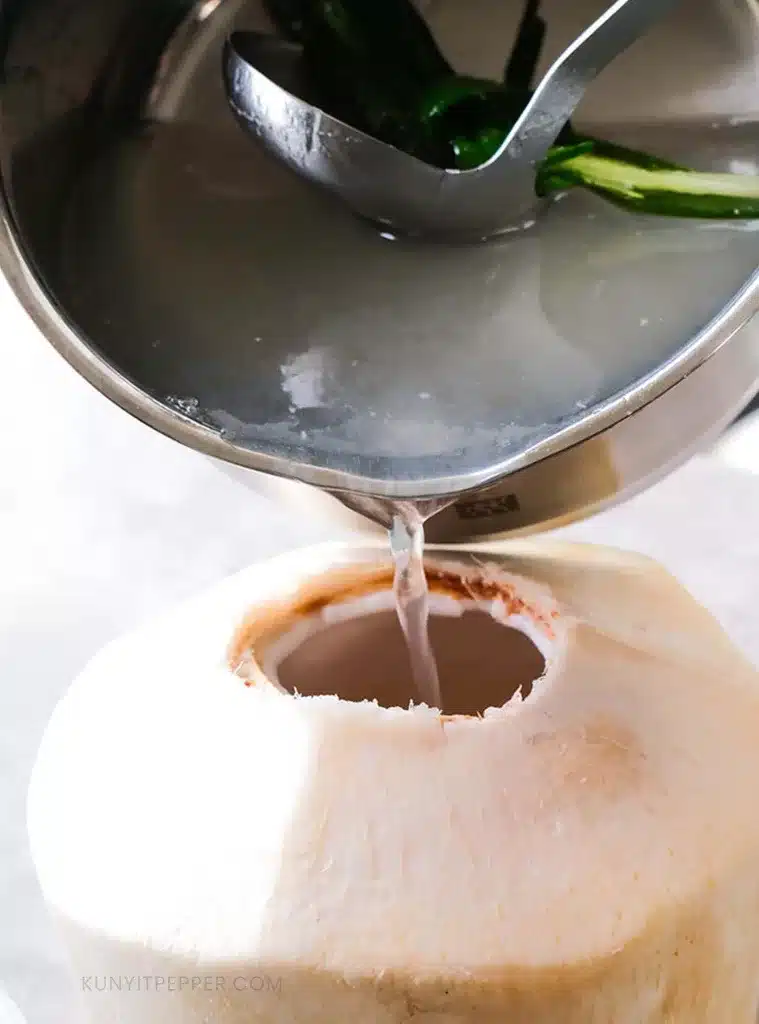 Pouring coconut water jelly in a coconut shell