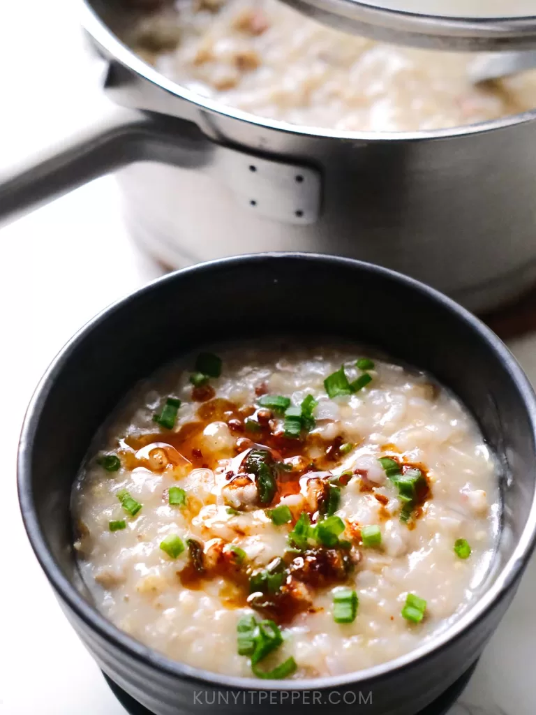 Asian Multigrain Ginger Chicken Porridge in a bowl drizzled in chili olive oil and scallion