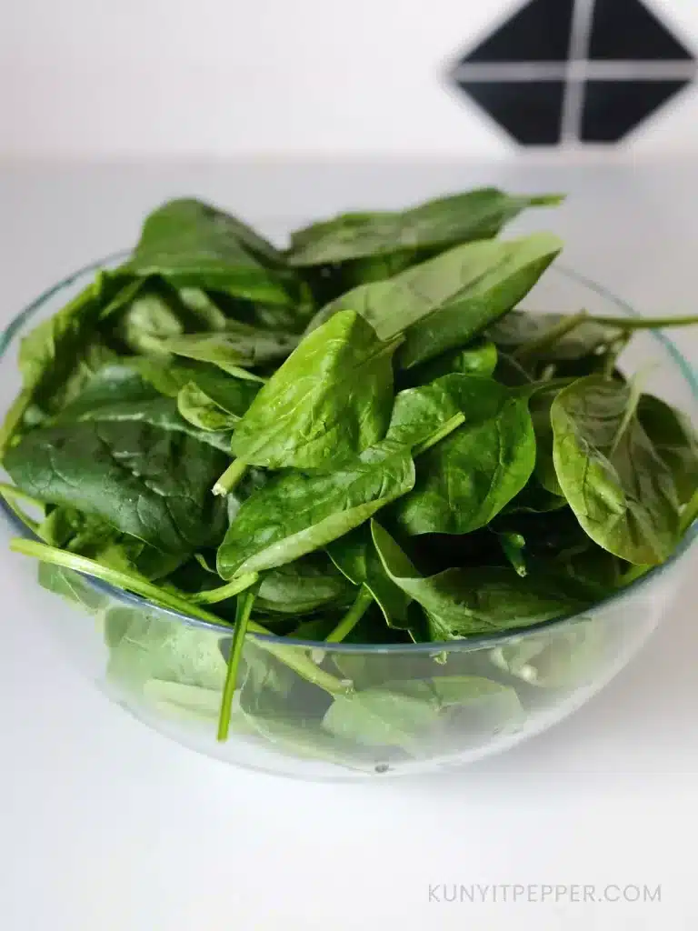 Baby spinach in a transparent bowl