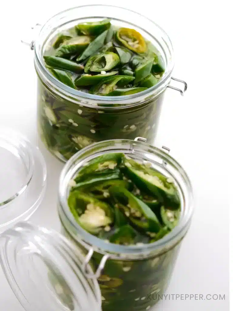 2 open jars of pickled green chilli