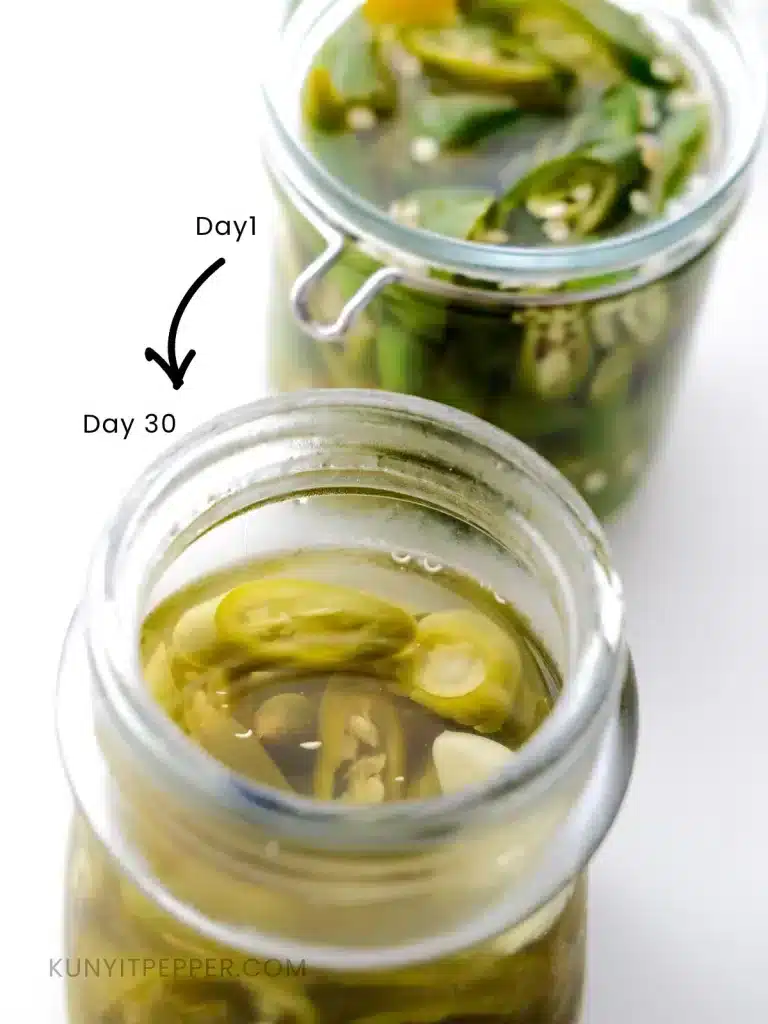 2 jars or green chilli pickles; front jar is yellowed after pickled for 1 month, back jar is new and still green. overlay text showing arrow, Day 1 and Day 30